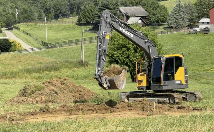 Breaking ground for the schoolhouse foundation